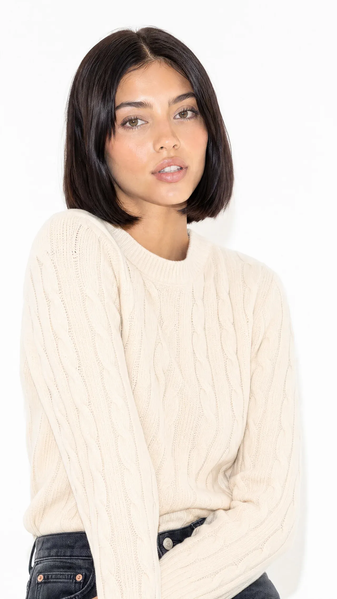 AI-generated portrait of a woman in a cream knit sweater